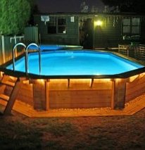 backyard swimming pool above ground lighted